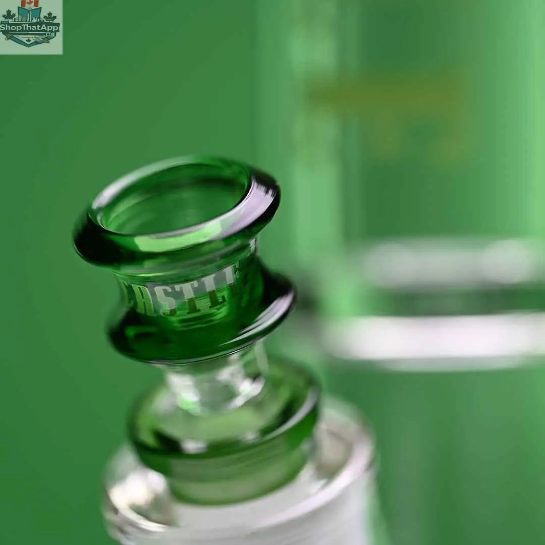 Castle Glassworks 14-inch beaker bong with green logo, 9mm thickness, and 9-hole downstem, shown with bowl on green background.