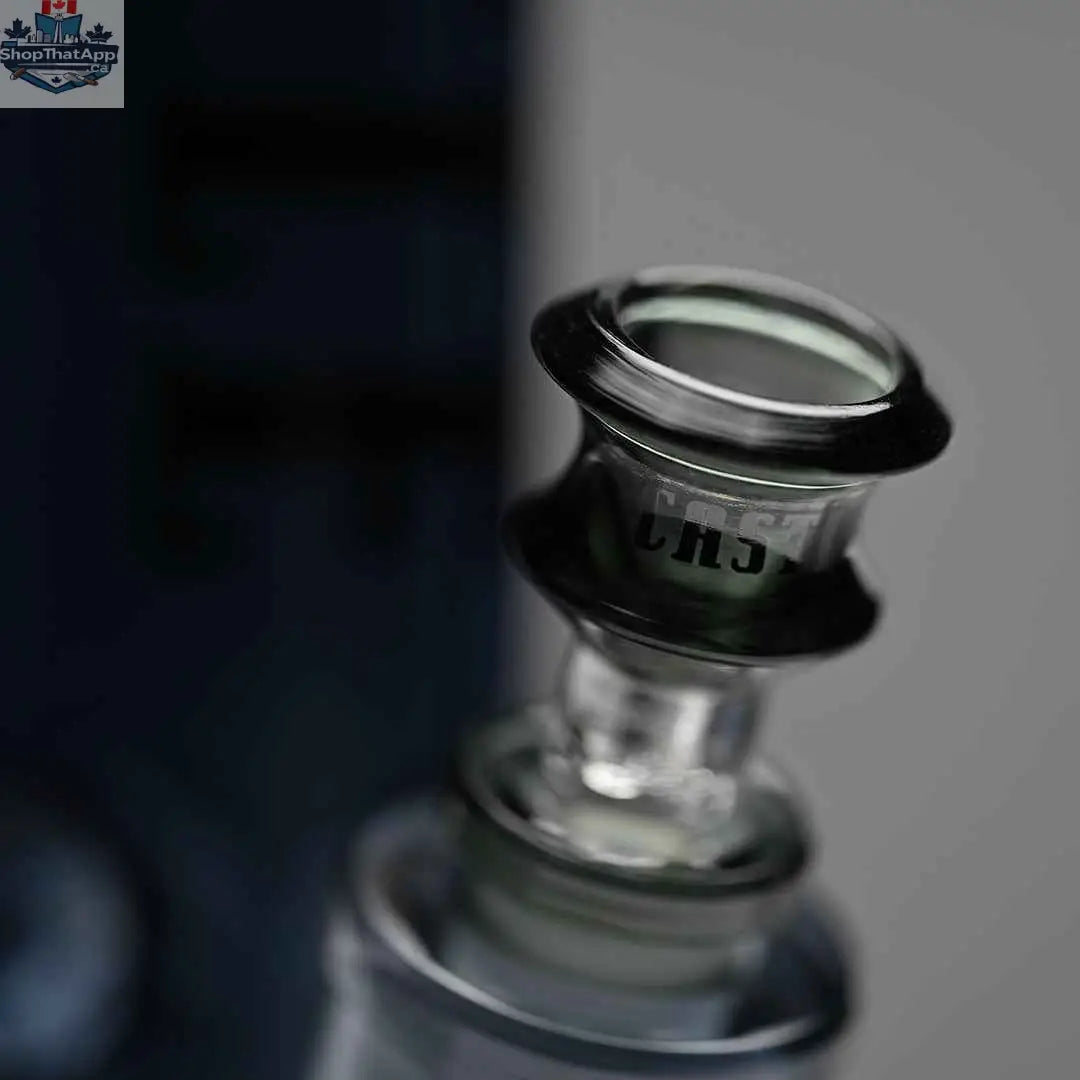 Close-up of a 14-inch Castle Glassworks beaker bong with heavy-duty electroplated grey glass and a clear bowl on a grey background.