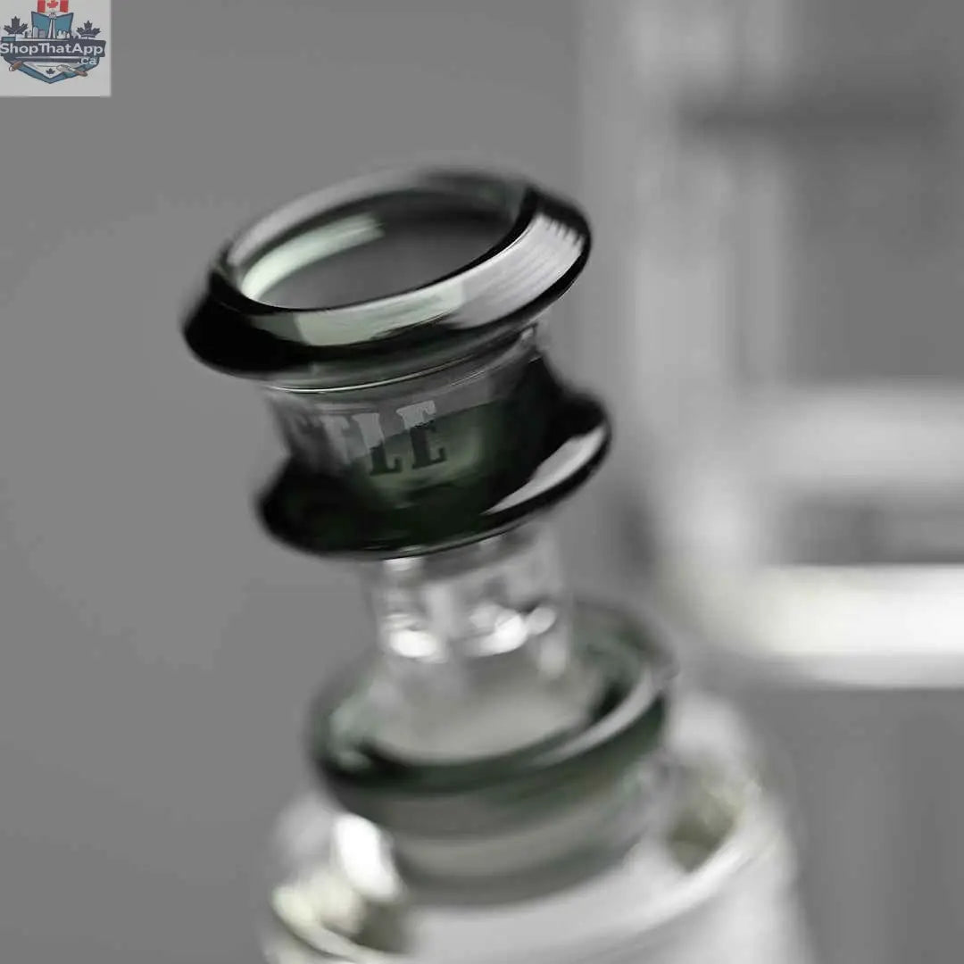 Castle Glassworks 14-inch beaker bong with colored logo and 9-hole downstem, close-up shot against grey background.