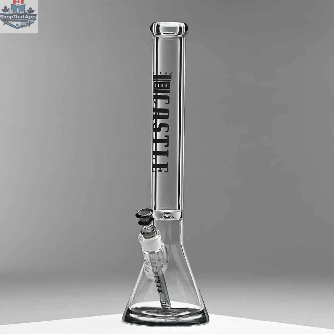 Castle Glassworks 18-inch glass beaker bong with a grey background, 9mm thick glass and colored logo for durable use and stylish design.
