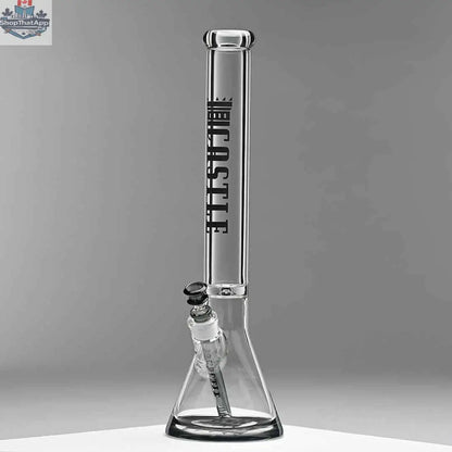 Castle Glassworks 18-inch glass beaker bong with a grey background, 9mm thick glass and colored logo for durable use and stylish design.