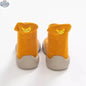 Wild Baby sock shoes for babies, soft fabric with colorful patterns, designed for comfort and easy wear.