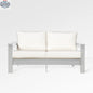 Enclover Hickory loveseat with white Sunbrella® cushions, outdoor sofa featuring a sturdy frame and comfortable seating.