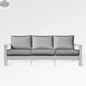 Enclover Hickory outdoor sofa with white Sunbrella cushion, stylish patio seating for outdoor comfort and relaxation.