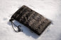 Black Hot Poc Sleeper eco reusable heat pack designed for outdoor phone protection, featuring a compact, durable design.