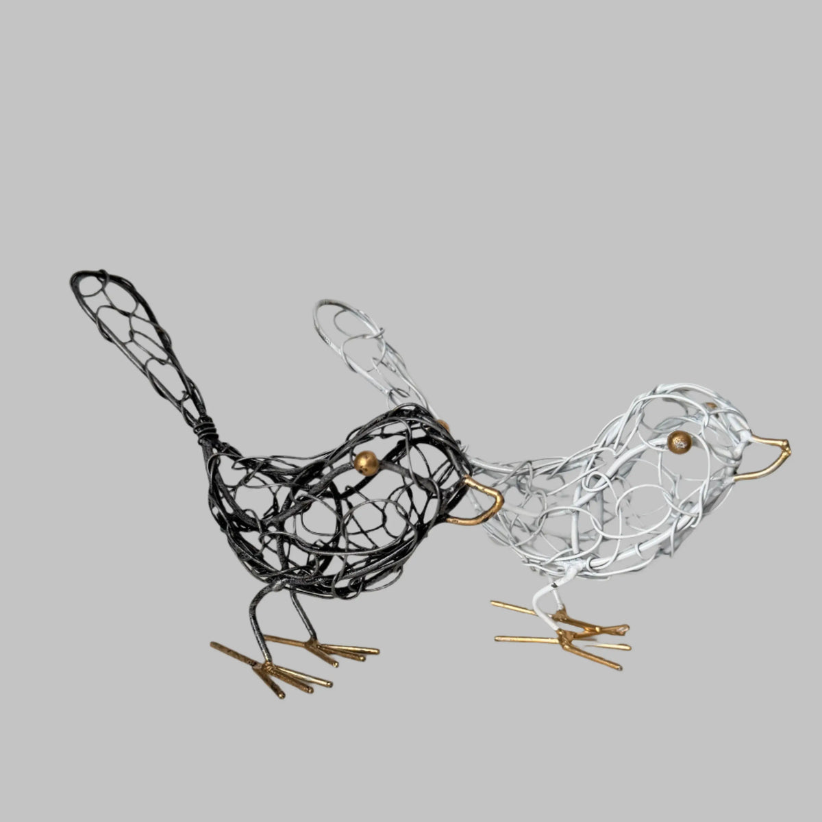 Black wire bird sculpture for home decor, artistically crafted decorative wire art piece by Suzie Blue Canada.
