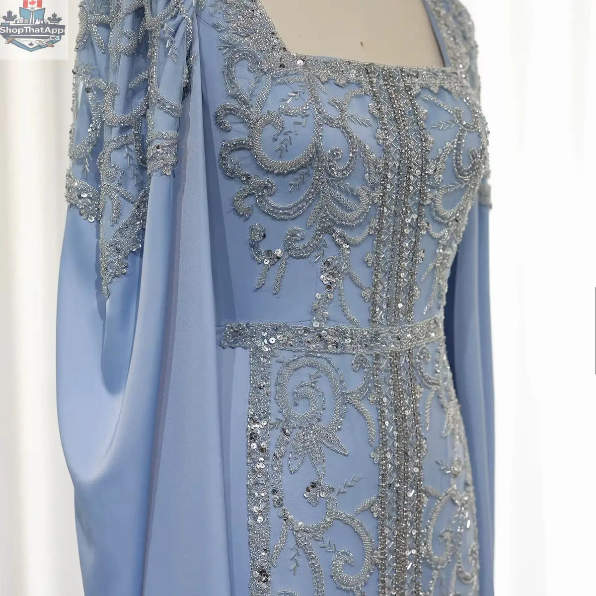 Elegant Threads evening kaftan gown with cape sleeves, perfect for elegant occasions, featuring flowing fabric and intricate details.