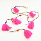 Colorful tassel garland by Suzie Blue Canada with vibrant tassels for festive home décor and celebrations.