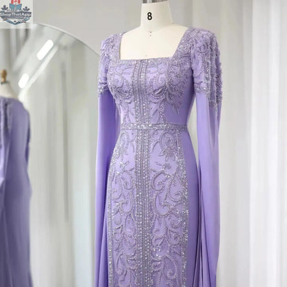Elegant Threads evening kaftan gown with cape sleeves, featuring intricate embroidery for stylish occasions.