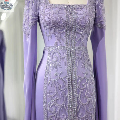 Elegant Threads evening kaftan gown with cape sleeves, perfect for elegant occasions, featuring flowing fabric and intricate design.
