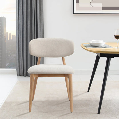 Nero Vogar dining chair by Hygge Design House with black upholstery and wooden legs, modern and stylish for dining room.