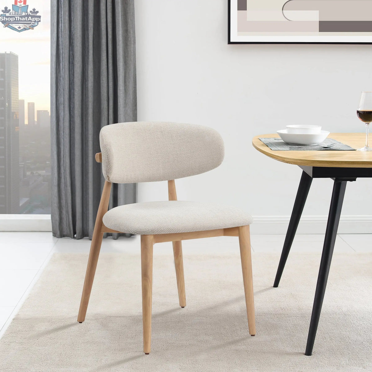 Nero Vogar dining chair by Hygge Design House with sleek black seat and wooden legs, modern and stylish for dining rooms