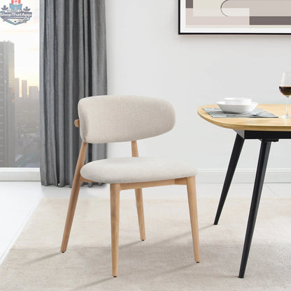 Nero Vogar dining chair by Hygge Design House with sleek black seat and wooden legs, modern and stylish for dining rooms