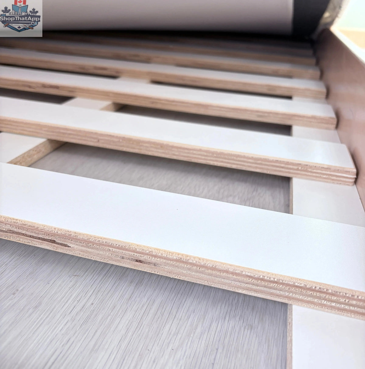 Sapiens Child Cherry Twin Montessori Floor Bed for kids, featuring a wooden frame and a cozy, child-friendly design.
