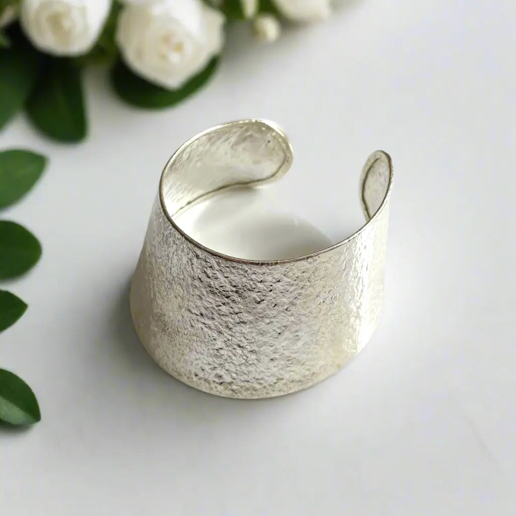 Elegant silver wide bangle bracelet for women, showcasing a sleek silver plate design from Suzie Blue Canada.