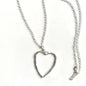 Silver chain necklace with open heart pendant by Suzie Blue Canada, featuring a delicate silver heart design.