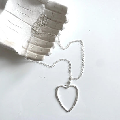 Silver chain necklace with open heart pendant featuring a silver plate design, crafted by Suzie Blue Canada.