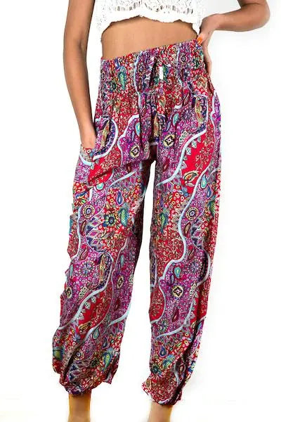 Red and pink paisley print pants by Suzie Blue Canada featuring a stylish, comfortable, and versatile design in a casual fit.