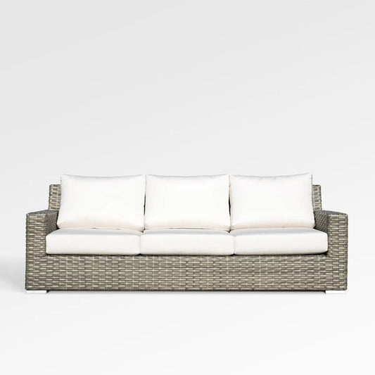 Enclover Jasmine outdoor sofa with white Sunbrella cushions, stylish and comfortable for outdoor lounging.
