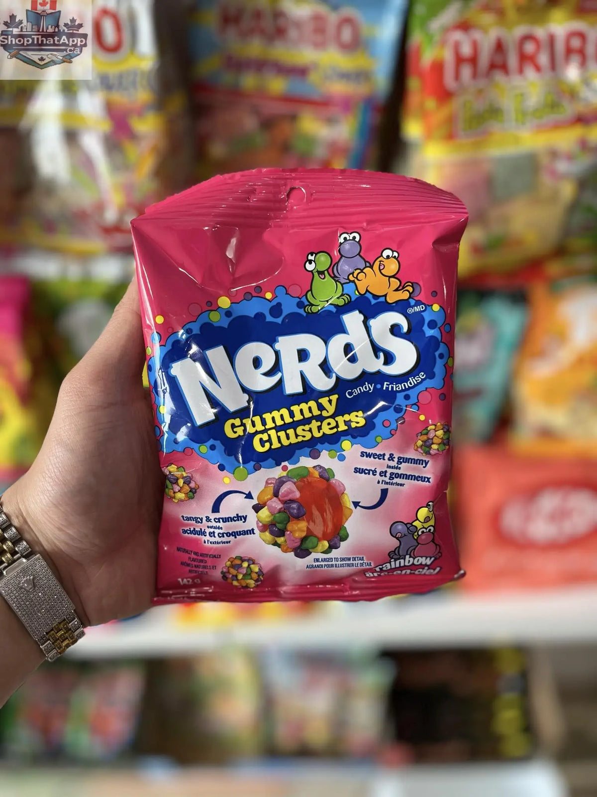 Colorful NERDS Gummy Clusters candy treats from Snack Bar Co in a 142g bag, showing vibrant gummy cluster pieces.
