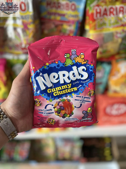 Colorful NERDS Gummy Clusters candy treats from Snack Bar Co in a 142g bag, showing vibrant gummy cluster pieces.