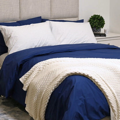 Organic percale duvet cover set and pillowcases from Skylark+Owl Canada, featuring a crisp, clean, and breathable design.