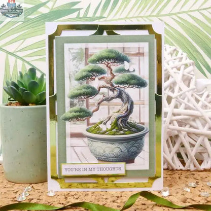 Open book titled "The Little Book of Eastern Treasures" by Ecstasy Crafts, featuring intricate paper and cardstock crafts.