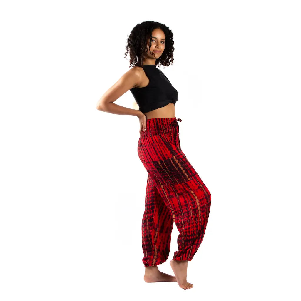 Tie-dye Bali pants with bone motif from Suzie Blue Canada, showcasing relaxed fit and vibrant, colorful pattern.
