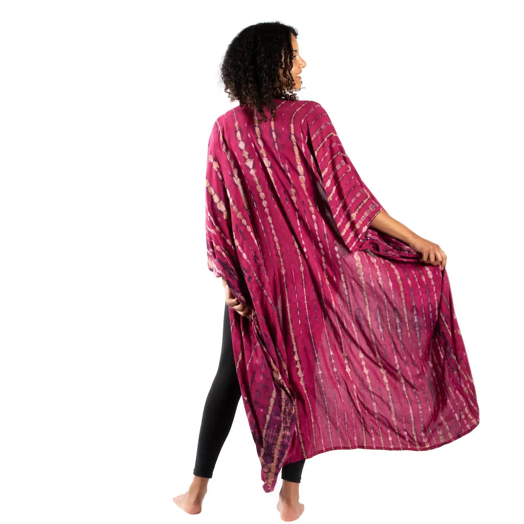 Tie-dye long kimono with bone motif by Suzie Blue Canada featuring flowing fabric and vibrant colors.