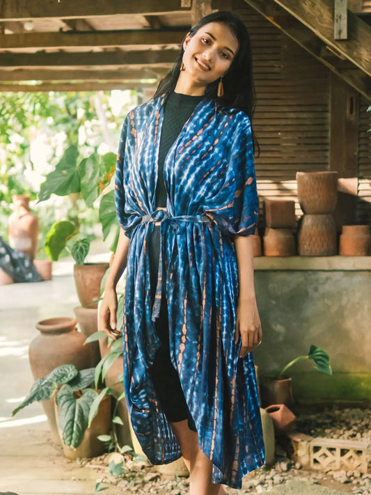 Blue tie dye long kimono by Suzie Blue Canada, stylish and vibrant cover-up with flowing fabric and intricate tie dye pattern.