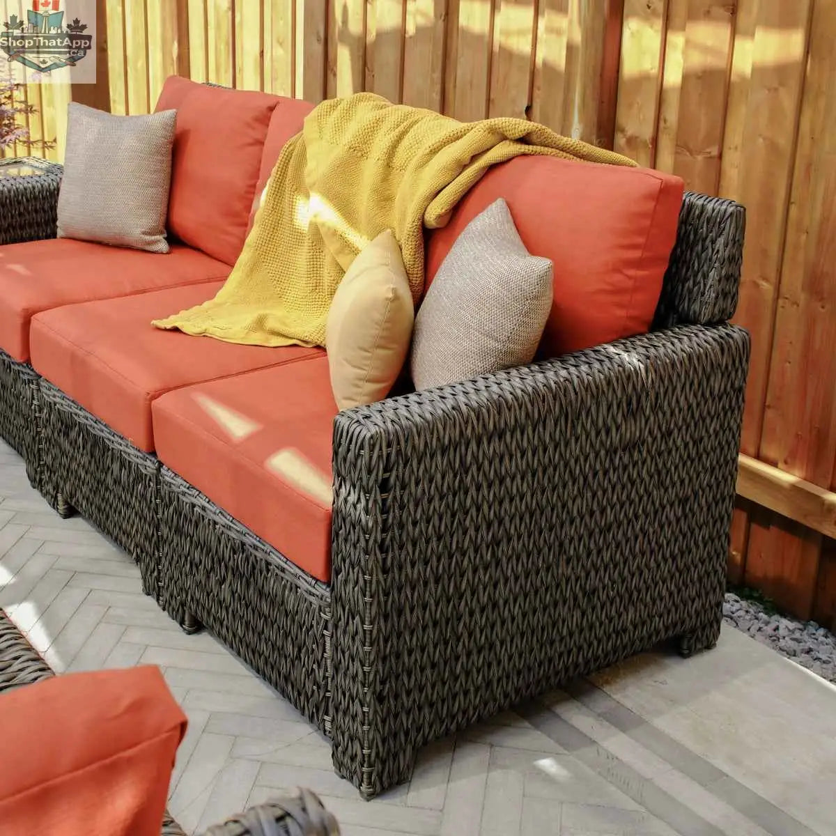 Krikacy Laguna Point outdoor wicker conversational set with cushioned chairs and a central table for stylish outdoor living.