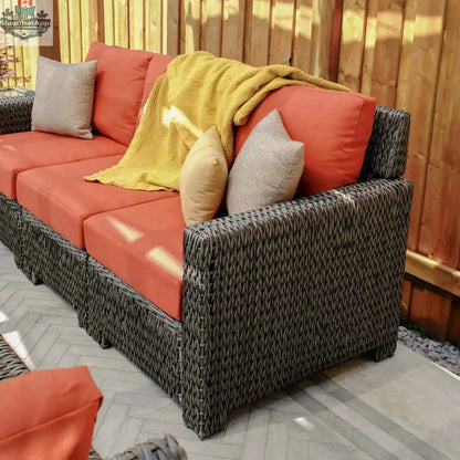 Krikacy Laguna Point outdoor wicker conversational set with cushioned chairs and a central table for stylish outdoor living.