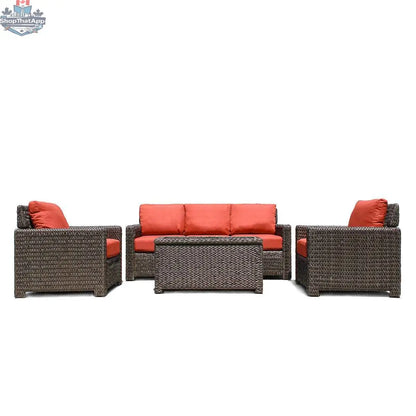 Krikacy Laguna Point outdoor wicker conversational set with brown wicker frames and bright orange cushions, ideal for patio seating.