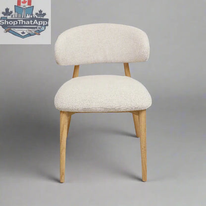 Hygge Design House Nero Vogar dining chair with wooden legs and upholstered seat, modern Scandinavian style for dining rooms