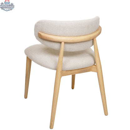 Hygge Design House Nero Vogar dining chair with a sleek wooden frame and upholstered seat, modern and stylish for dining rooms.