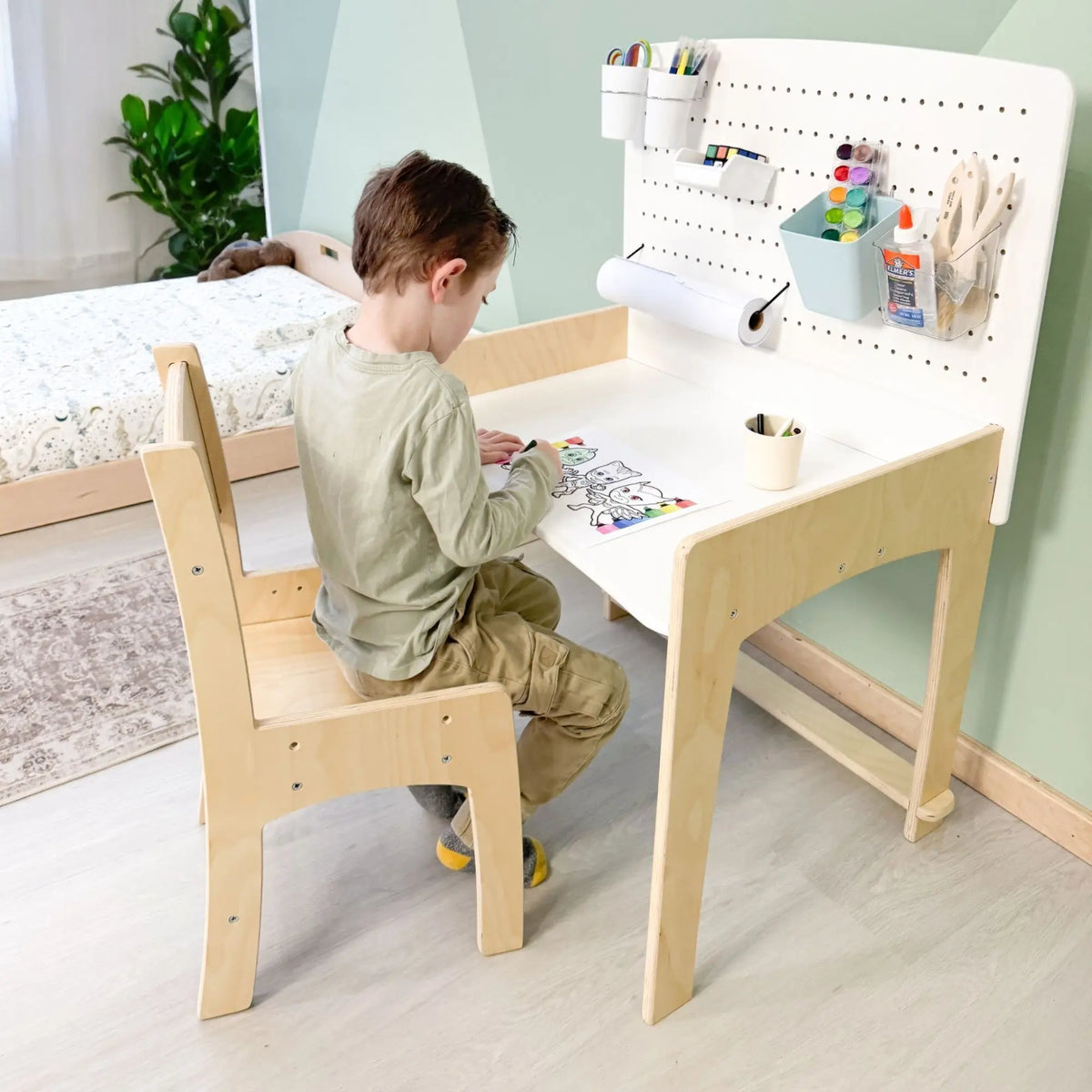 Sapiens Child LUMEN adjustable height kids' desk and chair set, modern study furniture for growing children in a home office setting.