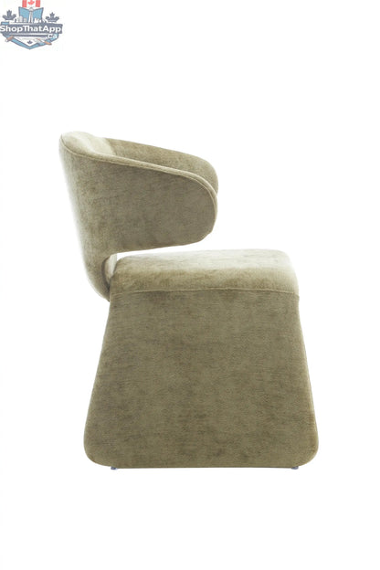 Oriana sculpted dining chair by Hygge Design House, featuring a sleek, modern design with a cushioned seat and wooden legs.