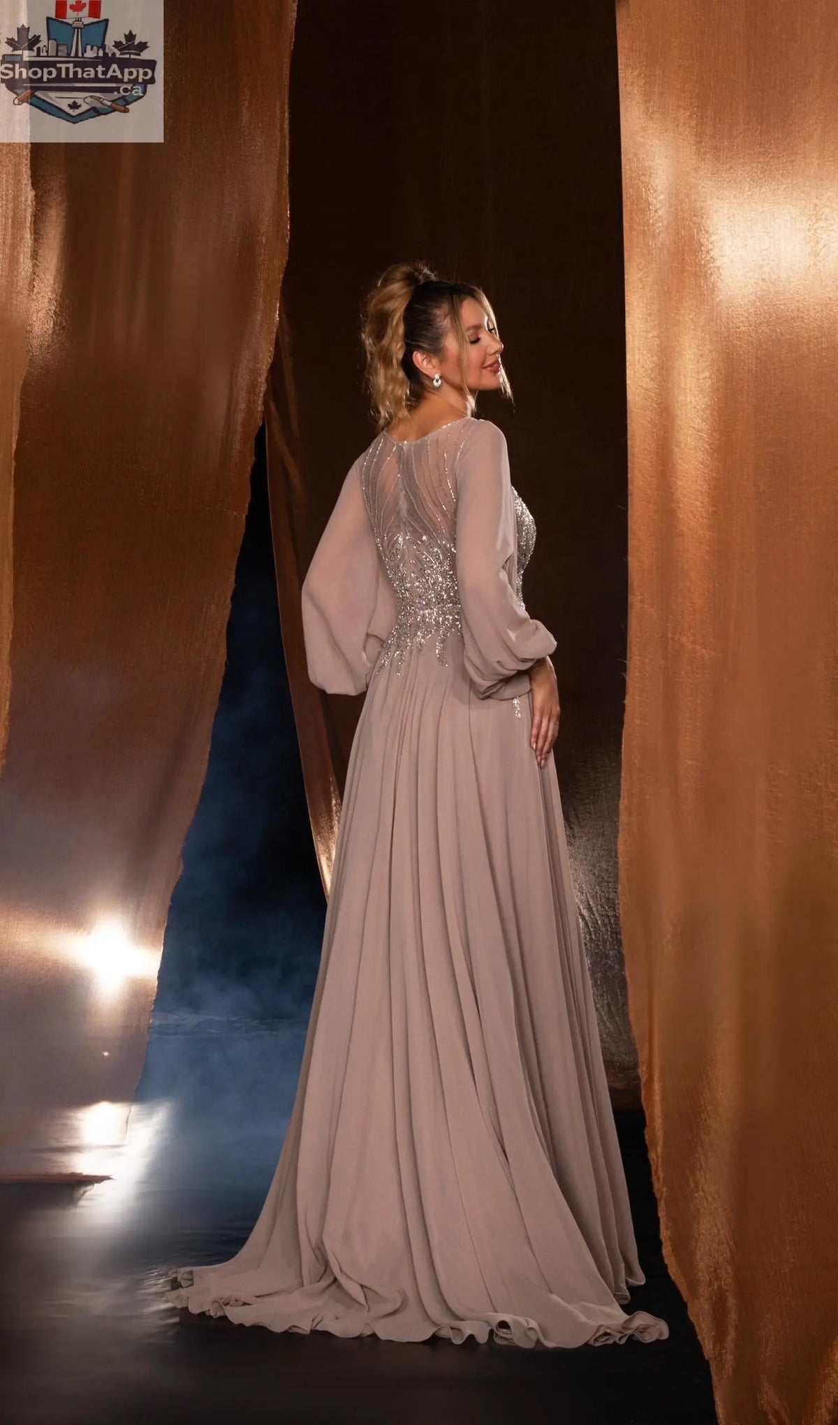 Elegant Threads long evening gown with balloon sleeves and beaded detailing, showcasing a stylish black design.