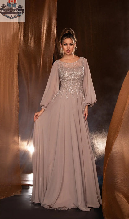Elegant Threads long evening gown with balloon sleeves and beaded detailing, showcasing a flowing silhouette and intricate embellishments.
