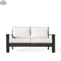 Magnolia black aluminum loveseat by Krikacy with Sunbrella® cushions, showcasing a front view with canvas bird's eye pattern.