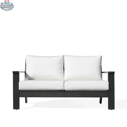 Krkacy Magnolia black aluminum loveseat with Sunbrella® white cushions, showcasing a modern outdoor sofa with comfortable seating.