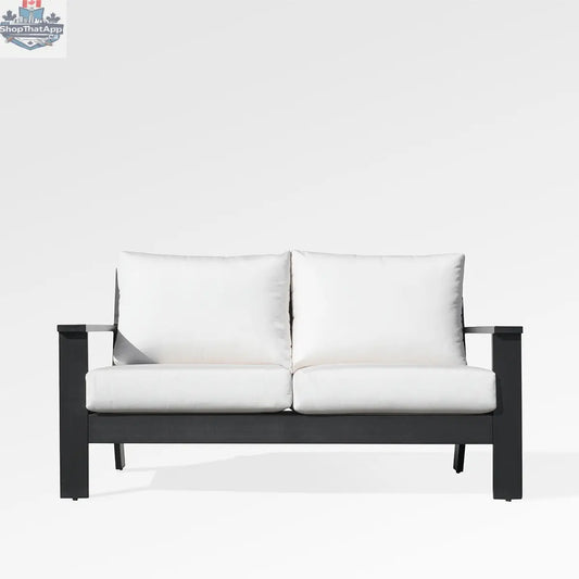 Magnolia black aluminum loveseat by Enclover with Sunbrella® white canvas cushions, shown from the front.