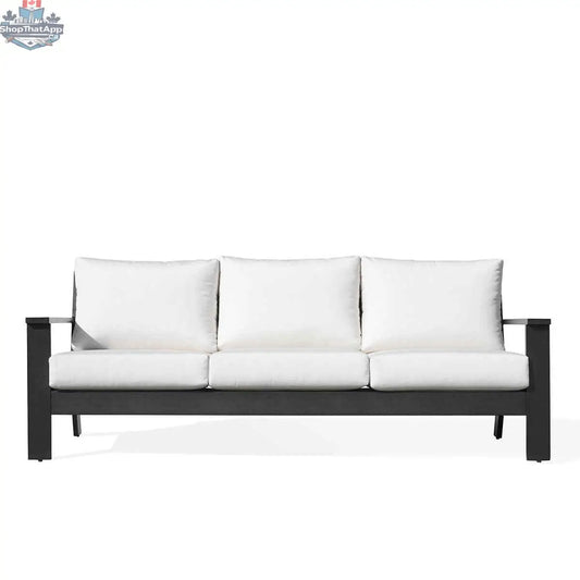 Magnolia black aluminum sofa by Krikacy with Sunbrella® white canvas cushions, modern outdoor seating with sleek design.