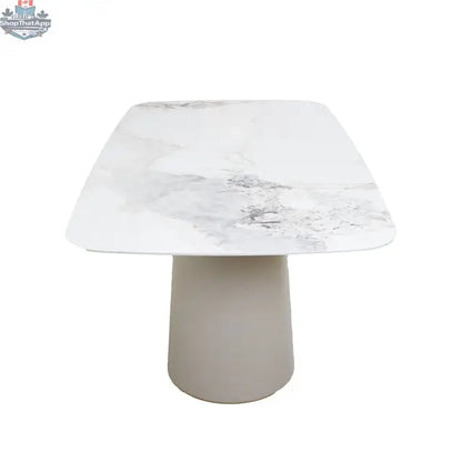Tove ceramic dining table by Hygge Design House featuring an elegant design with a smooth surface and modern style for dining rooms.