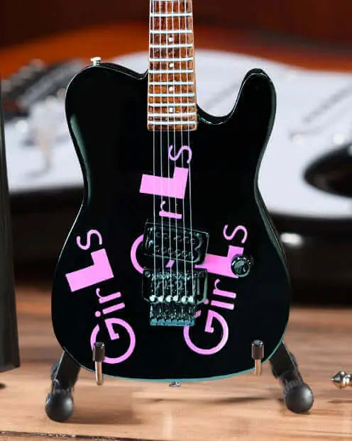 Little Guitars Signature Black Mick Mars Mini Guitar for Girls, showcasing a compact black electric guitar with signature design details.