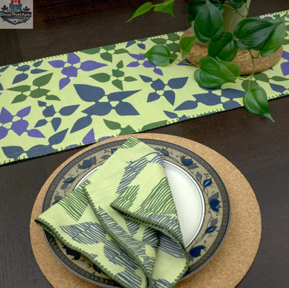 Set of four printed cotton dinner napkins in mint and green from Hem And Tassel, perfect for celebration dinners.