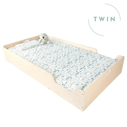 Sapiens Child Apple Twin Montessori Floor Bed with Rails in maple finish, designed for toddlers' safe, cozy sleep space.