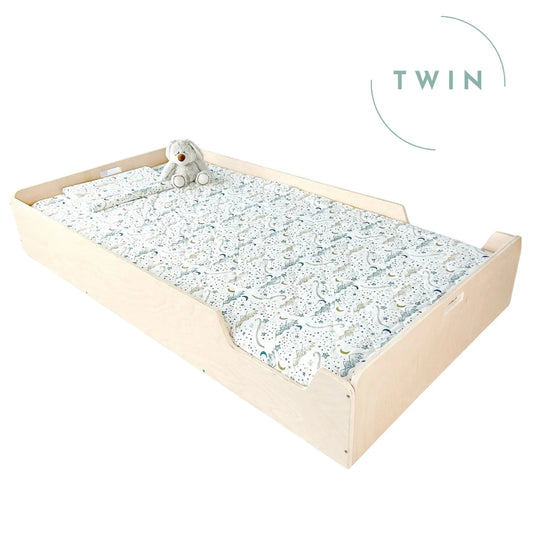 Sapiens Child Apple Twin Montessori Floor Bed with Rails in maple finish, designed for toddlers' safe, cozy sleep space.