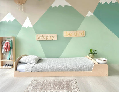 Sapiens Child Cherry Twin Montessori Floor Bed with built-in shelves, ideal for toddlers and growing kids' bedrooms.
