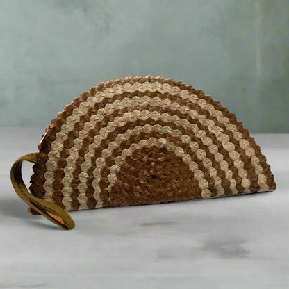 Pandan leaf clutch purse with half moon design in natural tones by Suzie Blue Canada, showcasing woven texture and compact shape.